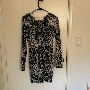 Bebe green print dress with gold details.